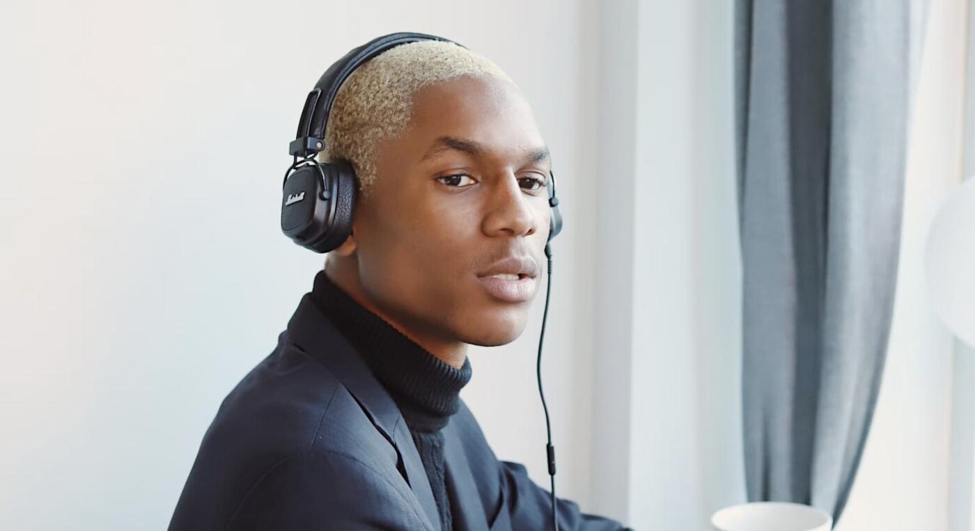 A professional wearing a headset while working at a desk, representing voice-based client intake